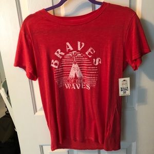 Billabong T-shirt with tags on it